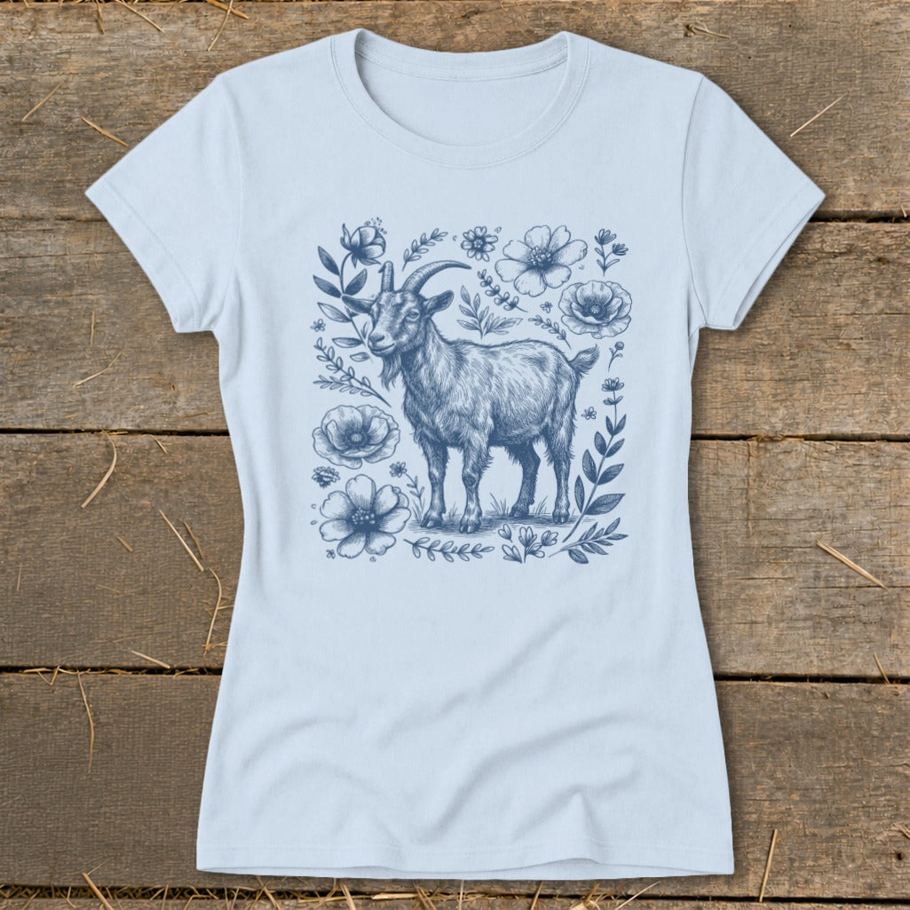 Light blue t-shirt with a blue sketch of a goat surrounded by flowers and leaves.