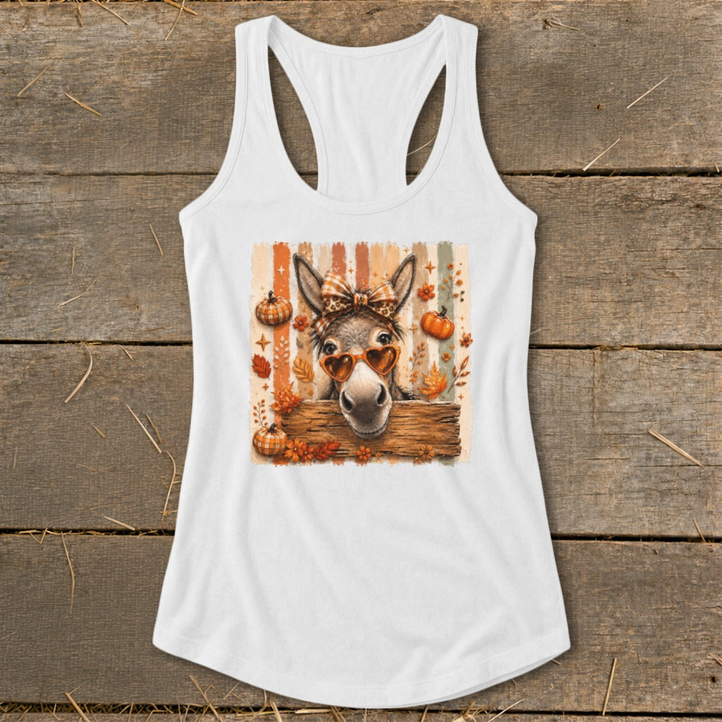 Donkey wearing heart sunglasses and bandana with pumpkins and leaves.