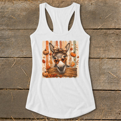 Donkey wearing heart sunglasses and bandana with pumpkins and leaves.