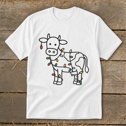 White t-shirt with a black outline drawing of a cow decorated with colorful Christmas lights.