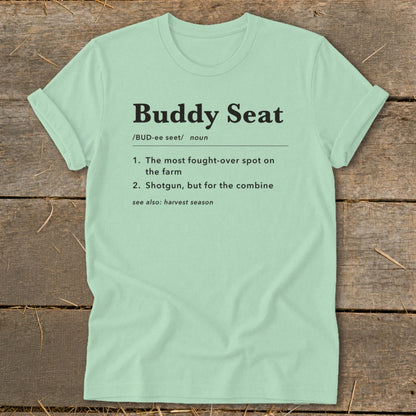 Light green t-shirt with "Buddy Seat" definition: fought-over spot on farm, shotgun for combine.