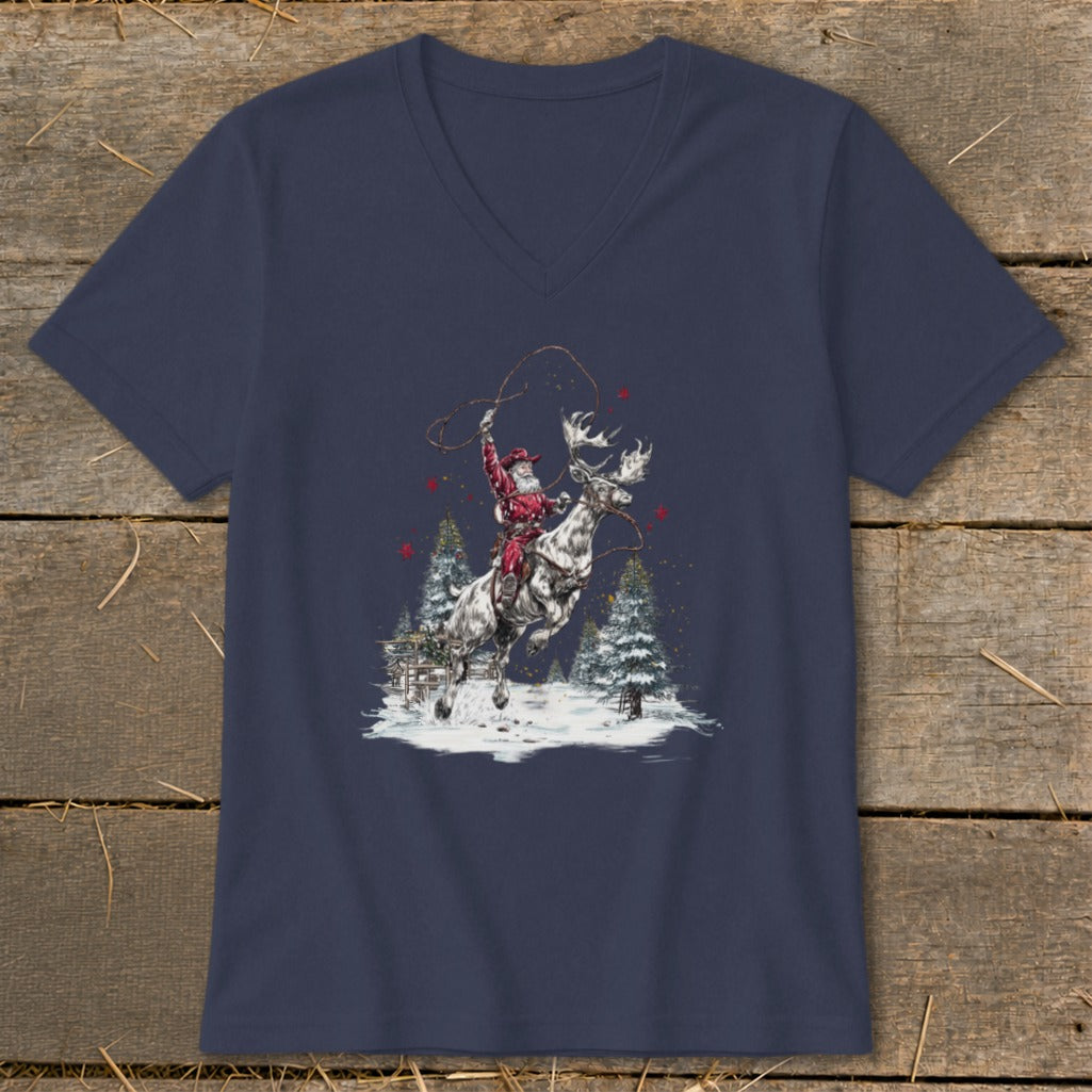 Santa Claus rides a reindeer with a lasso in a snowy forest scene.