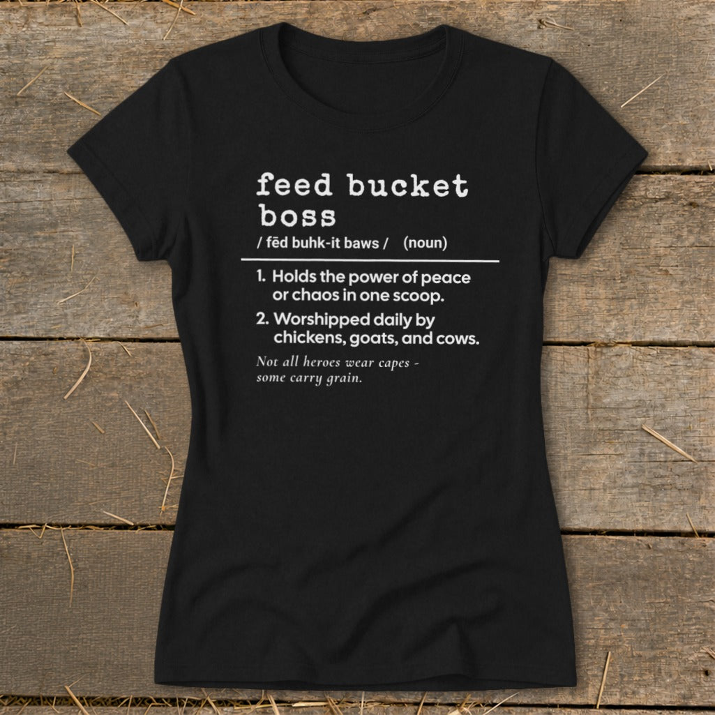 Black t-shirt with white text defining "feed bucket boss" and humorous descriptions.