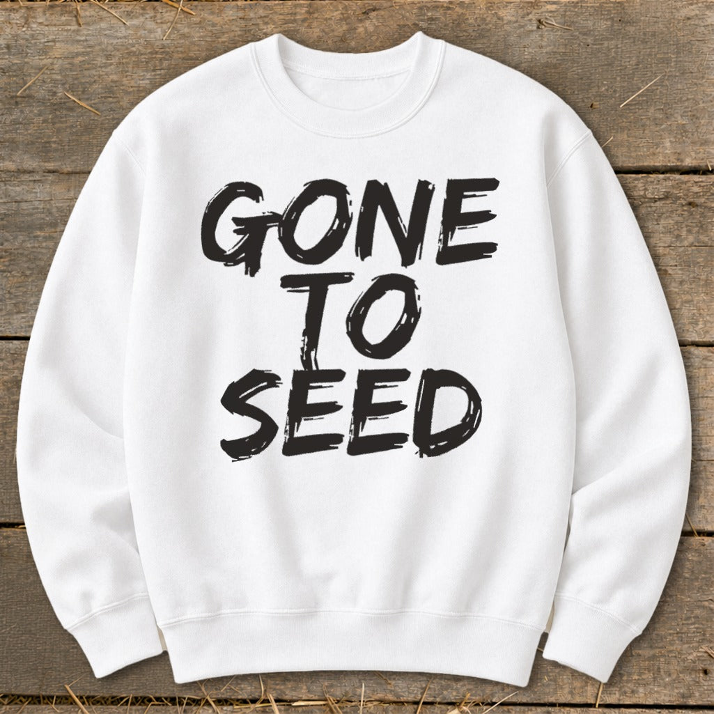 White sweatshirt with black text that reads "GONE TO SEED"