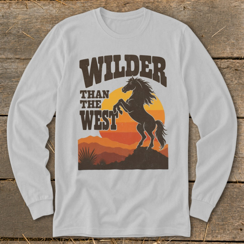 White long sleeve shirt with a graphic of a rearing horse and "Wilder Than The West" text.