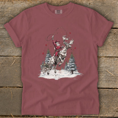 Santa riding a reindeer with lasso in snowy forest scene.