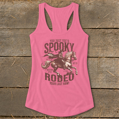Pink tank top with "Spooky Rodeo" graphic and witch on horse.