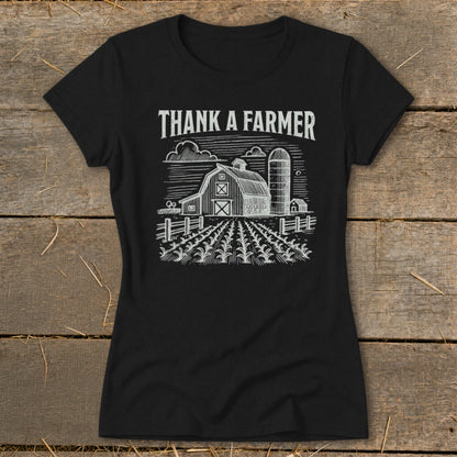 Black t-shirt with "Thank A Farmer" text above a barn and cornfield graphic.