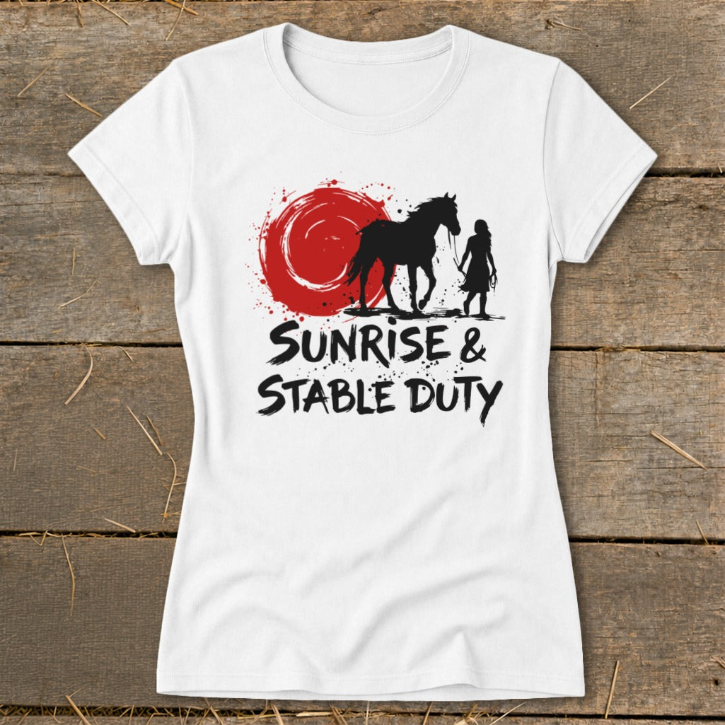 White t-shirt with silhouette of horse and person walking, red sunrise, and "Sunrise & Stable Duty" text.