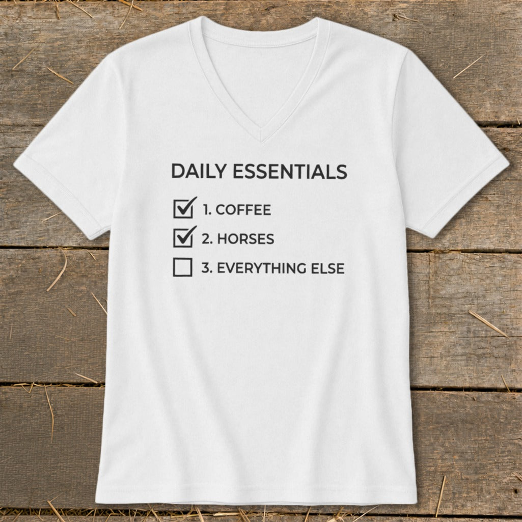 White t-shirt with "Daily Essentials: 1. Coffee, 2. Horses, 3. Everything Else" text.