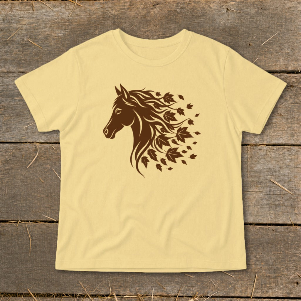 Light yellow t-shirt with a brown horse head graphic transitioning into falling leaves.