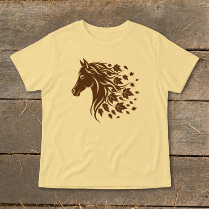 Light yellow t-shirt with a brown horse head graphic transitioning into falling leaves.