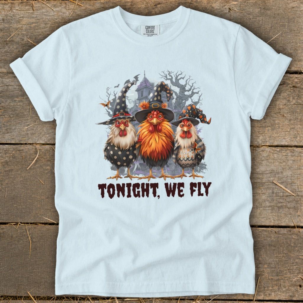 Three chickens in witch hats with the text "TONIGHT, WE FLY".