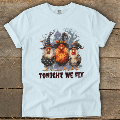 Three chickens in witch hats with the text "TONIGHT, WE FLY".