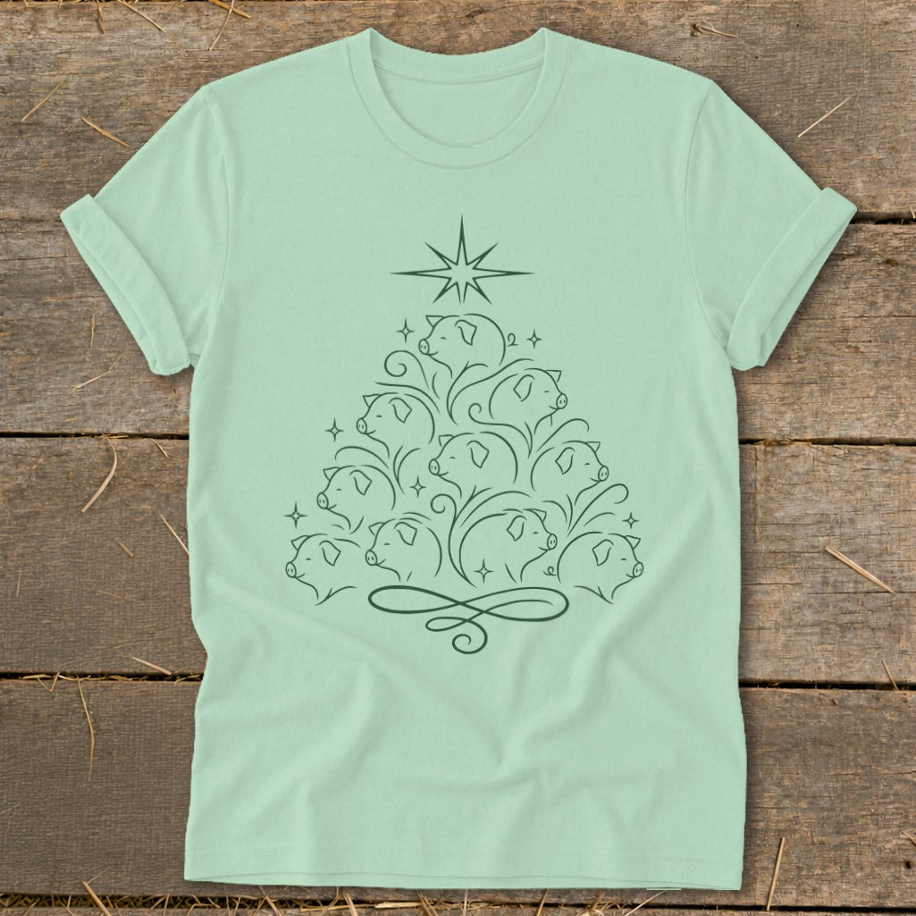 Light green t-shirt with a Christmas tree made of pig outlines and a star.