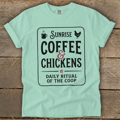 Mint green t-shirt with "Sunrise Coffee & Chickens Daily Ritual of the Coop" graphic.