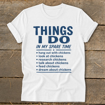 White t-shirt with text "Things I Do In My Spare Time" and chicken activities list.