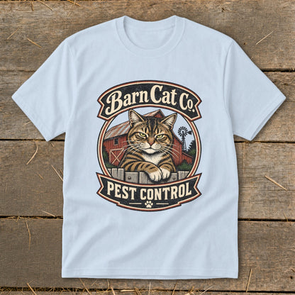 Light blue t-shirt featuring a circular graphic with a tabby cat, red barn, and Barn Cat Co. Pest Control text.