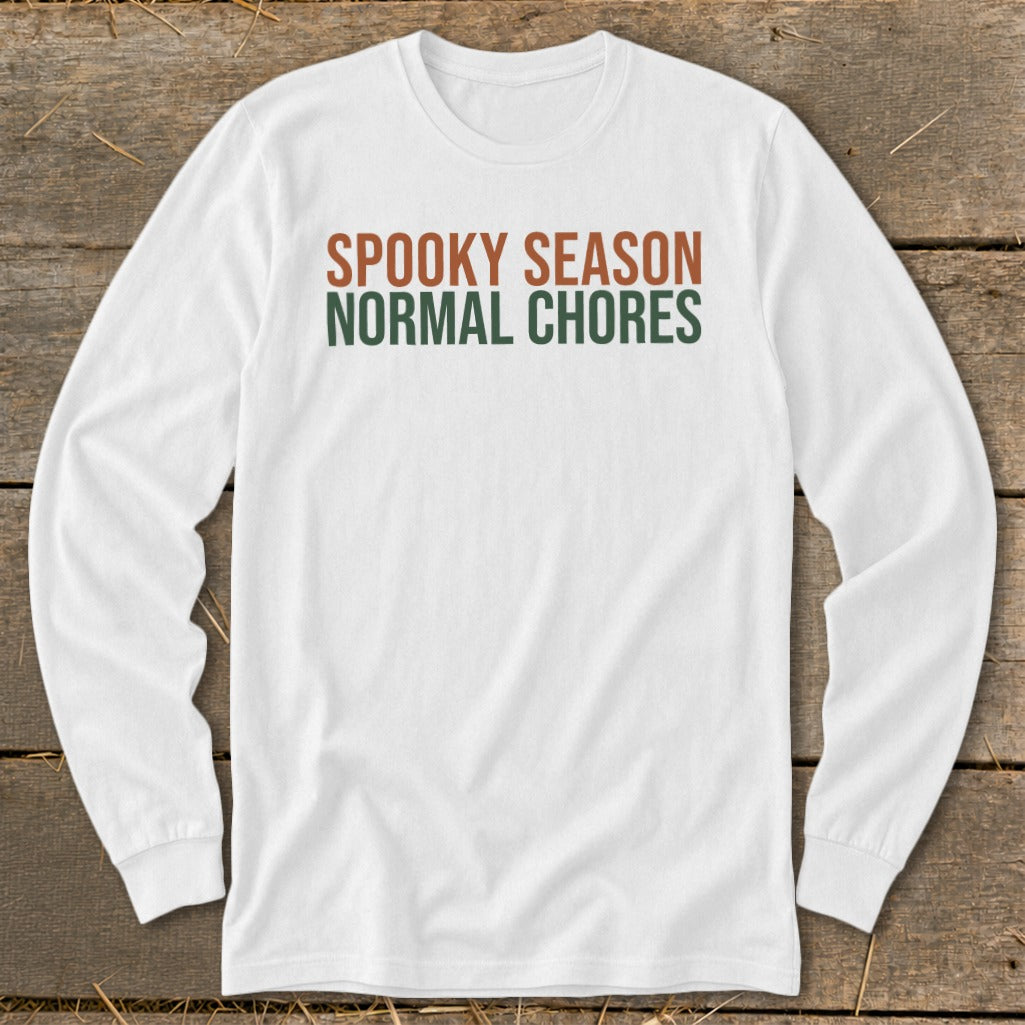 White long-sleeve shirt with "Spooky Season" and "Normal Chores" text.