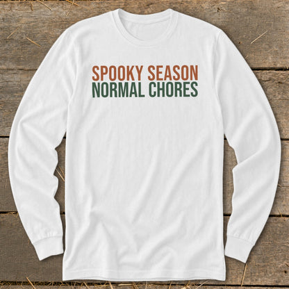 White long-sleeve shirt with "Spooky Season" and "Normal Chores" text.