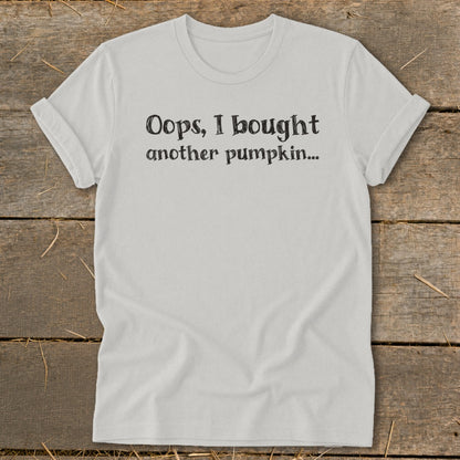 White t-shirt with black text "Oops, I bought another pumpkin..."