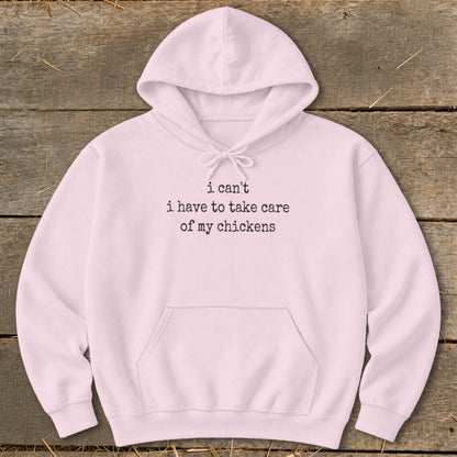 Pink hoodie with text "i can't i have to take care of my chickens".