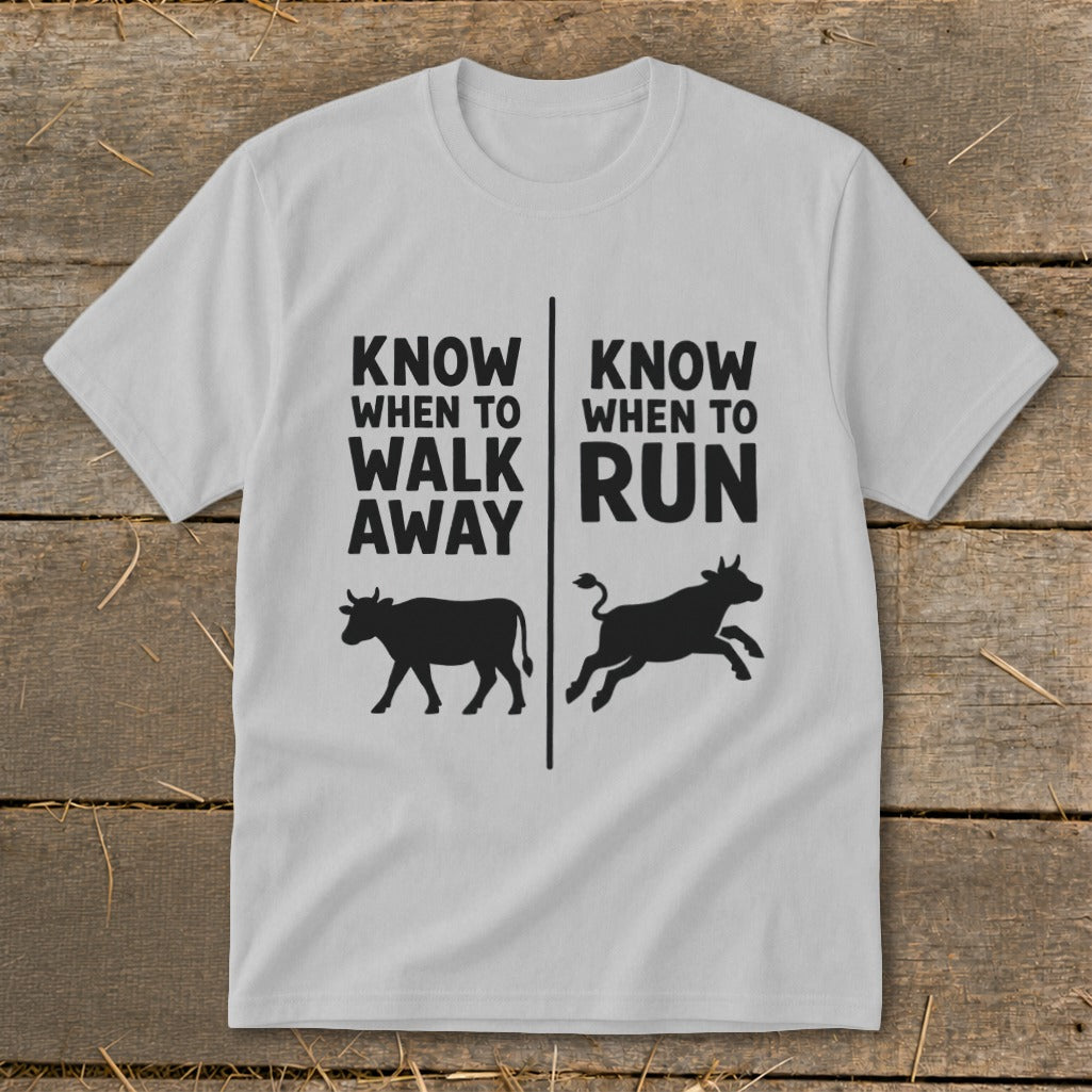 White t-shirt with black text and cow silhouettes: "Know when to walk away" and "Know when to run".