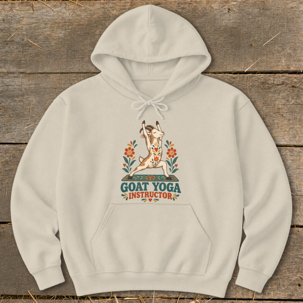 Cream hoodie with a graphic of a goat doing yoga and the words "Goat Yoga Instructor".