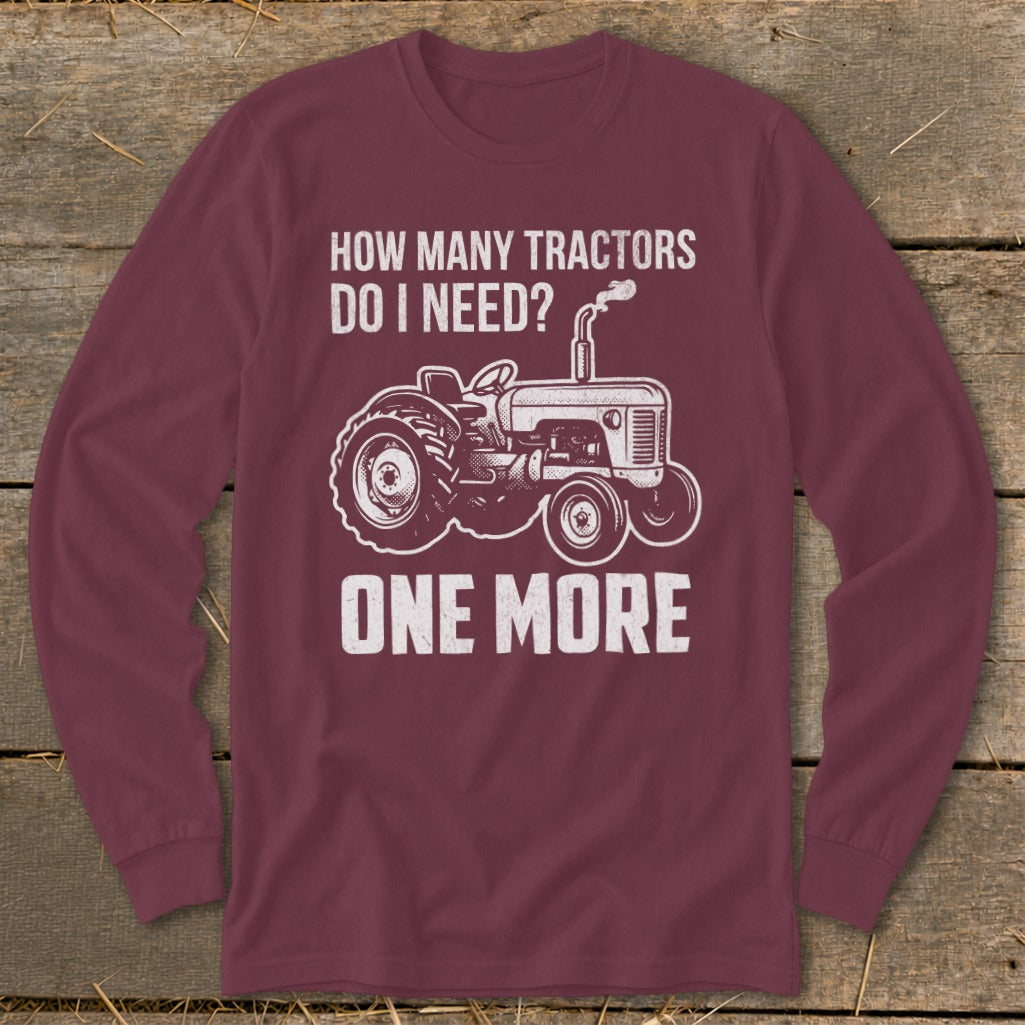 Maroon long-sleeve shirt with a tractor graphic and text "How Many Tractors Do I Need? One More".