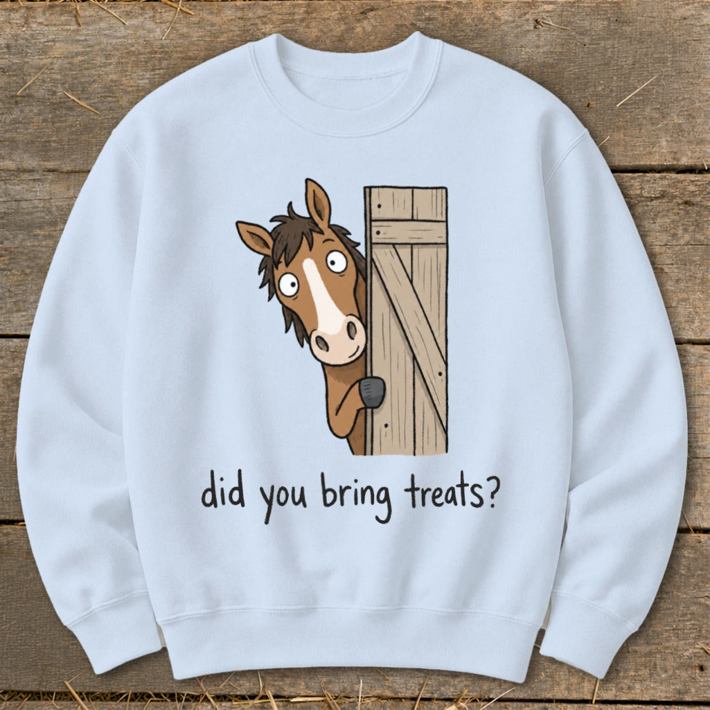 Light blue sweatshirt with cartoon horse peeking over a wooden gate asking "did you bring treats?".