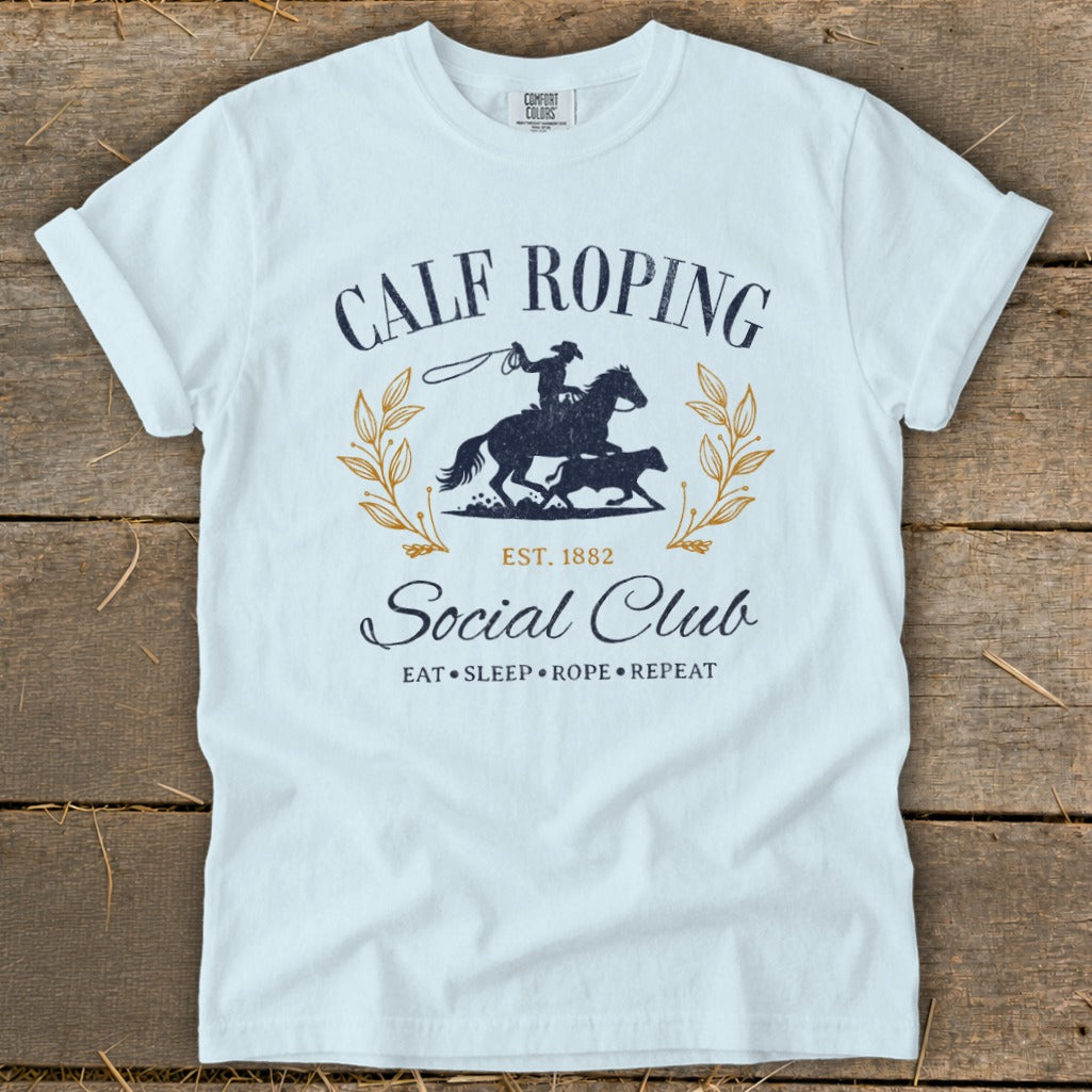 White t-shirt with "Calf Roping Social Club" text and rodeo graphic.