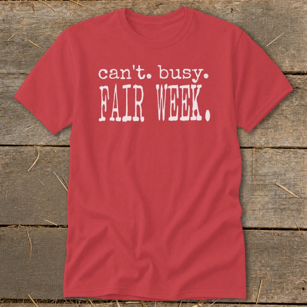 Red t-shirt with white text reading "can't. busy. FAIR WEEK."