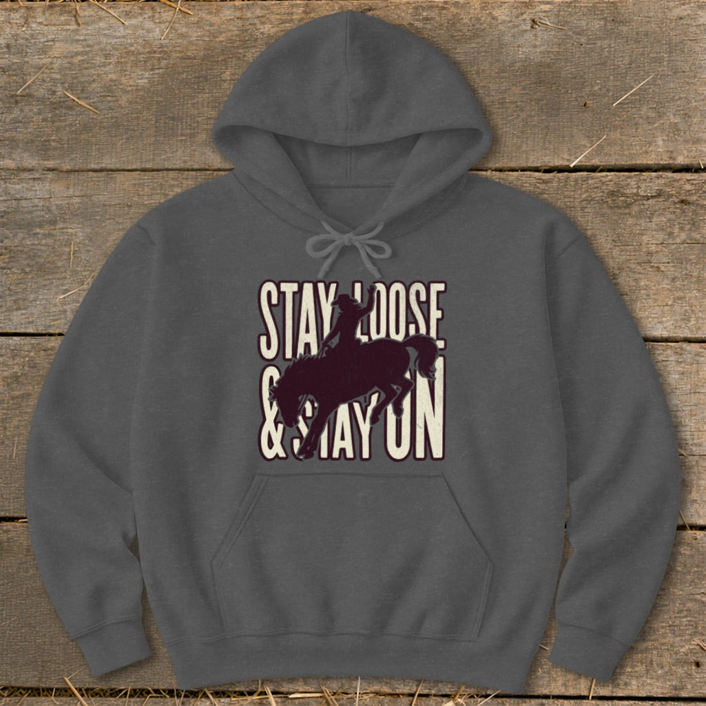 Dark grey hoodie with "STAY LOOSE & STAY ON" text and rodeo rider silhouette.