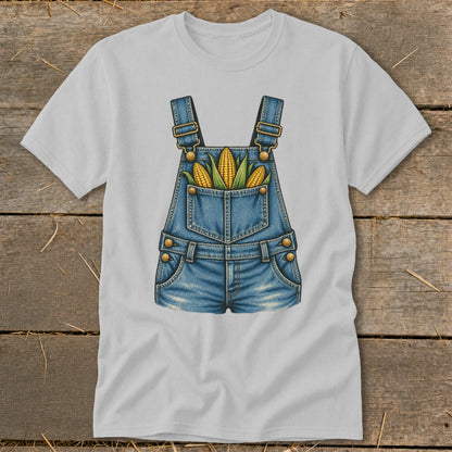 Light gray t-shirt with a denim overalls graphic featuring corn in the pocket.