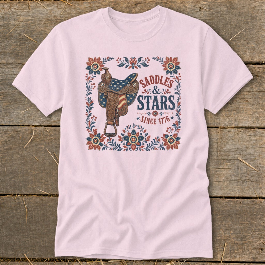 Pink t-shirt with vintage saddle graphic and text "Saddles & Stars Since 1776."