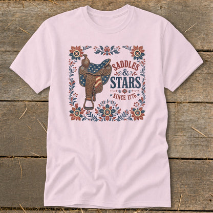 Pink t-shirt with vintage saddle graphic and text "Saddles & Stars Since 1776."