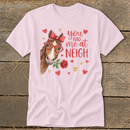 Pink t-shirt with horse wearing heart glasses and holding rose, text "you had me at NEIGH".