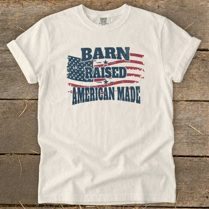 White t-shirt with distressed American flag design and text "Barn Raised American Made".