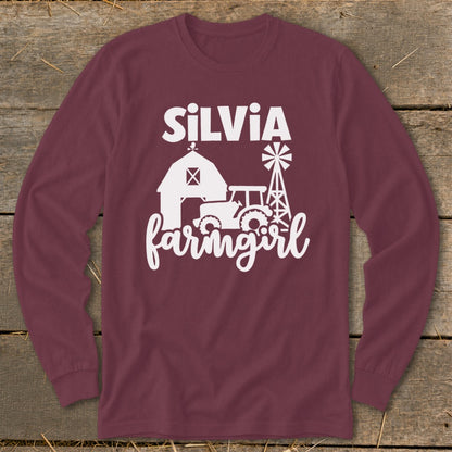 Maroon long-sleeve shirt with white text "SILVIA farmingirl" and farm graphics.
