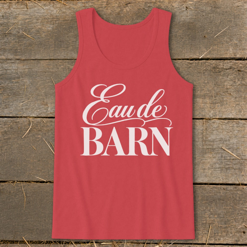 Red tank top with white "Eaude BARN" text on wooden background.