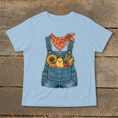 Light blue t-shirt with a denim overalls graphic featuring a chick and autumn harvest produce.