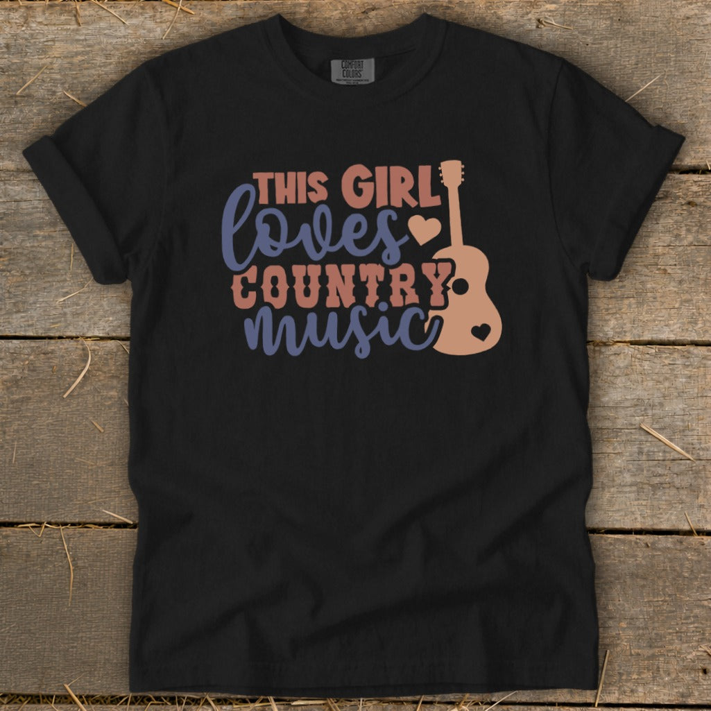 Black t-shirt with text "This girl loves country music" and guitar graphic.