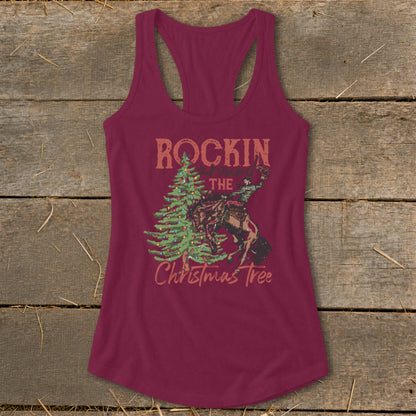 Maroon tank top with "Rockin' the Christmas Tree" graphic of cowboy on bucking horse.