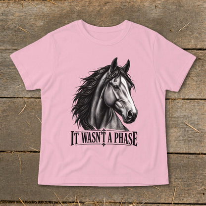 Pink t-shirt with a detailed sketch of a horse's head and the text "IT WASN'T A PHASE".