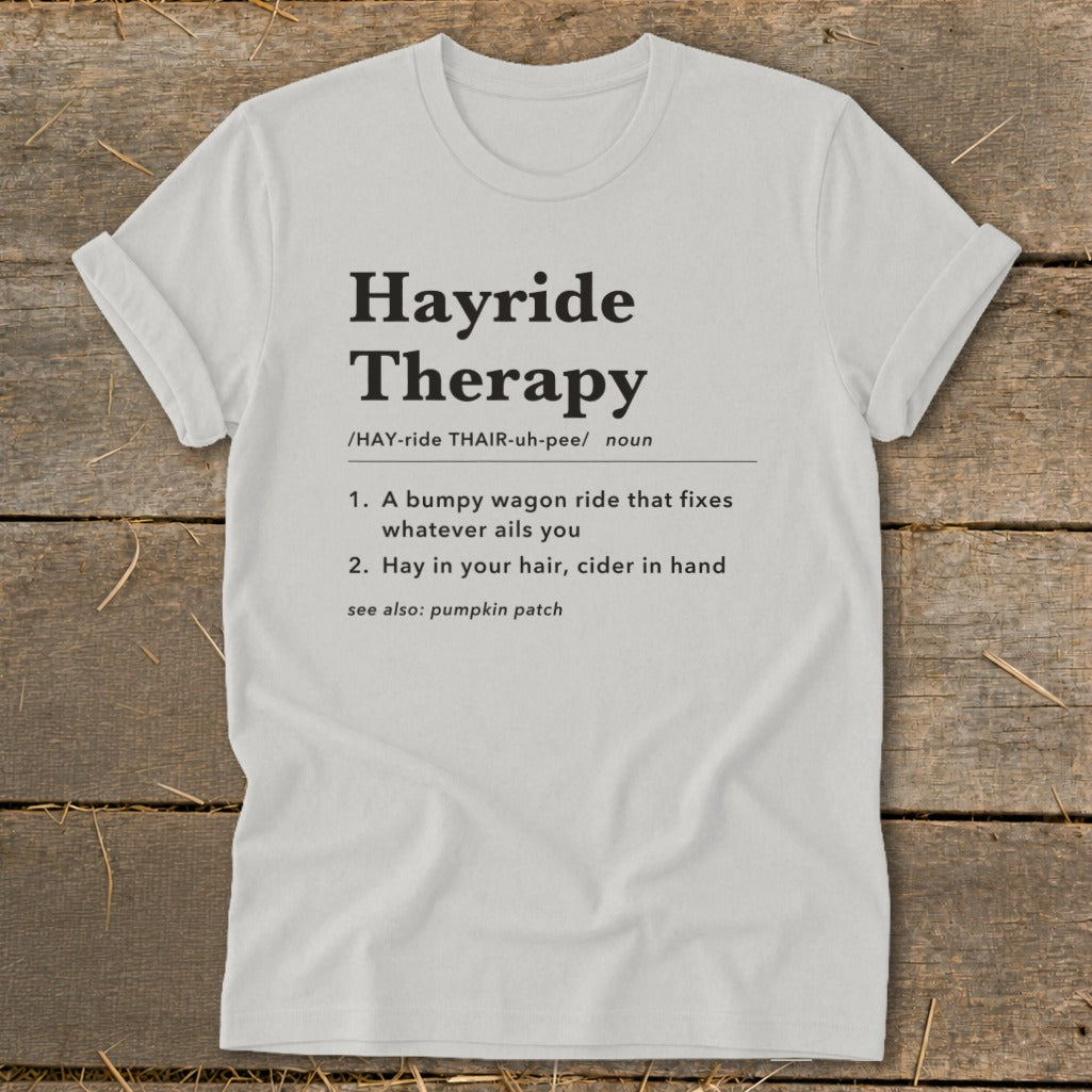 White t-shirt with "Hayride Therapy" definition printed in black text.