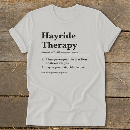 White t-shirt with "Hayride Therapy" definition printed in black text.