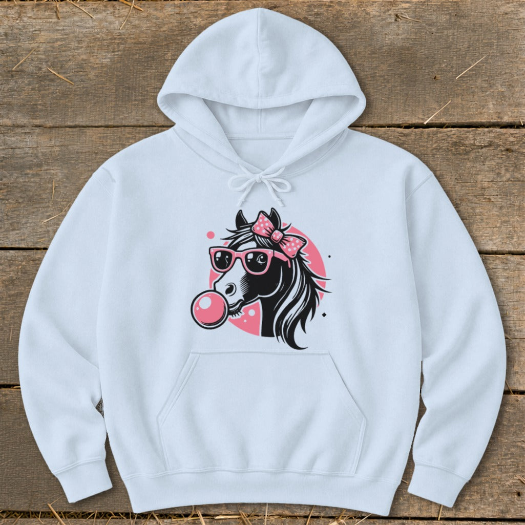 White hoodie with a graphic of a black horse wearing pink sunglasses and a pink bow, blowing bubblegum.
