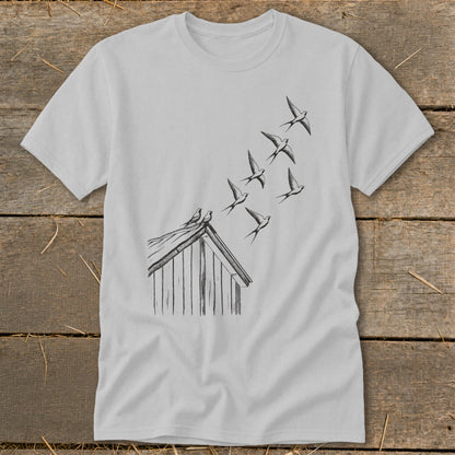 Light gray short-sleeve t-shirt featuring a black line drawing of swallows flying from a rooftop.