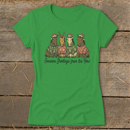 Green t-shirt with four cartoon horses wearing Santa hats and sweaters, with text "Seasons Greetings from the Herd".