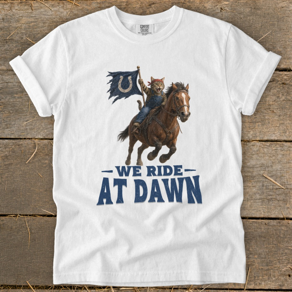 Cat in overalls riding a horse, carrying a blue flag with a horseshoe logo. "We Ride At Dawn" text.